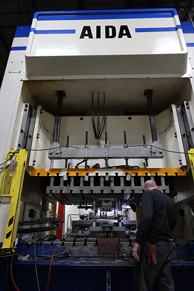 AIDA stamping press die setup for industrial equipment manufacturing
