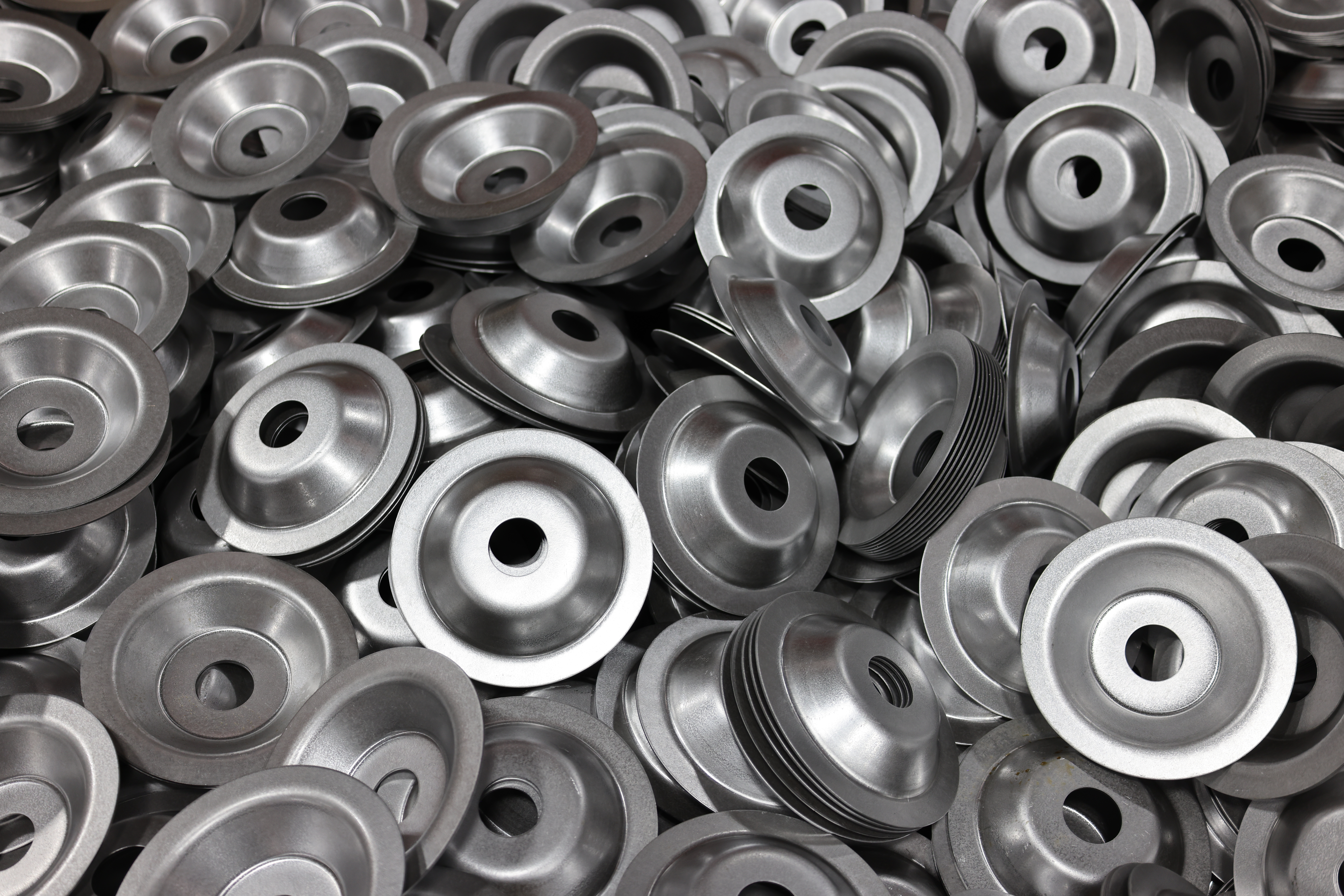 Deep drawn metal cups and washer components for electronic component manufacturing
